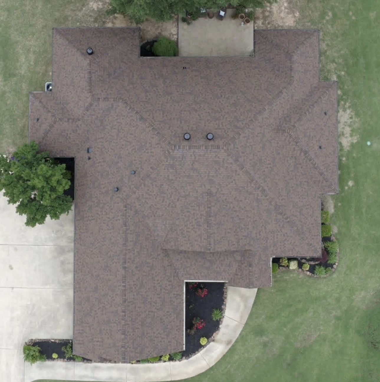Overhead drone photo of a finished residential roof replacement