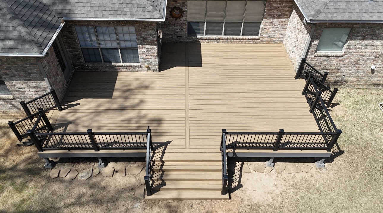 Aerial view of a wraparound composite deck with wide center stairs