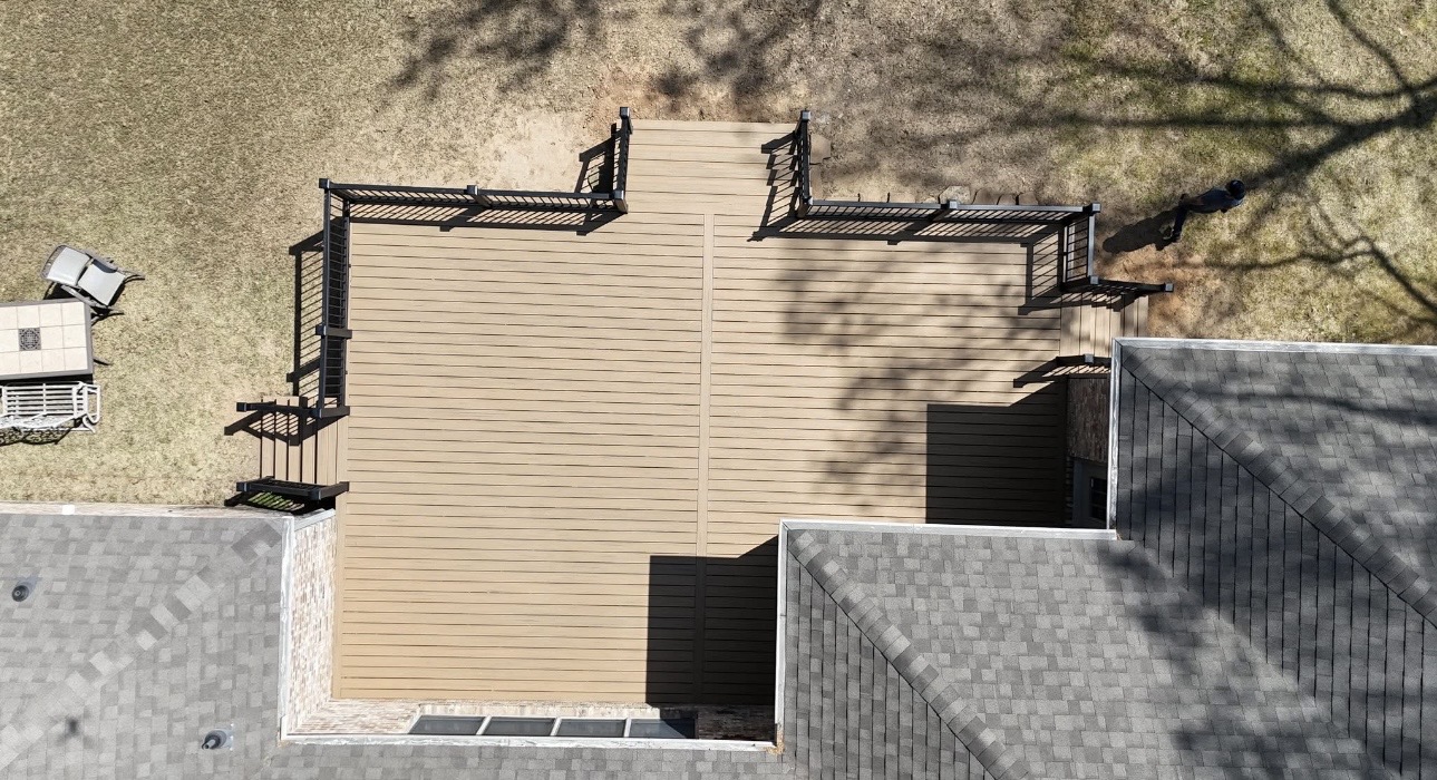Overhead drone view of a large composite deck with two pergolas